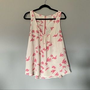 Kismet semi-sheer white with pink flared sleeveless top